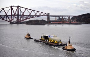 Part of the bow of HMS Queen Elizabeth being transported on the River Forth.