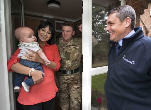 A CarillionAmey Accommodation Officer with a Service family. (Crown Copyright / MOD2014)