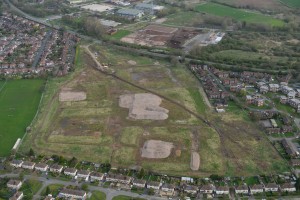 Aerial view of the site for the new homes in April 2014, prior to construction commencing. [Copyright Lovell]