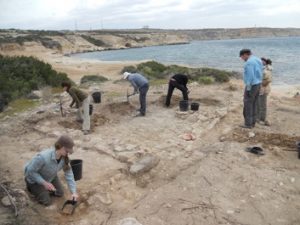 The Ancient Akrotiri Project team excavating one of the Roman buildings at Dreamer's Bay. [Crown Copyright, MOD 2017]