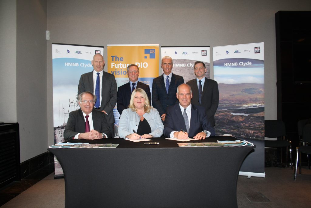 Jacqui Rock with representatives of the relevant organisations, posing while signing the Clyde Commercial Framework. [Crown Copyright, MOD 2018]