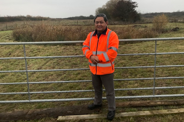 Major Udai Gurung, posing in a high-vis jacket in front of a gate on Fingringhoe Ranges.