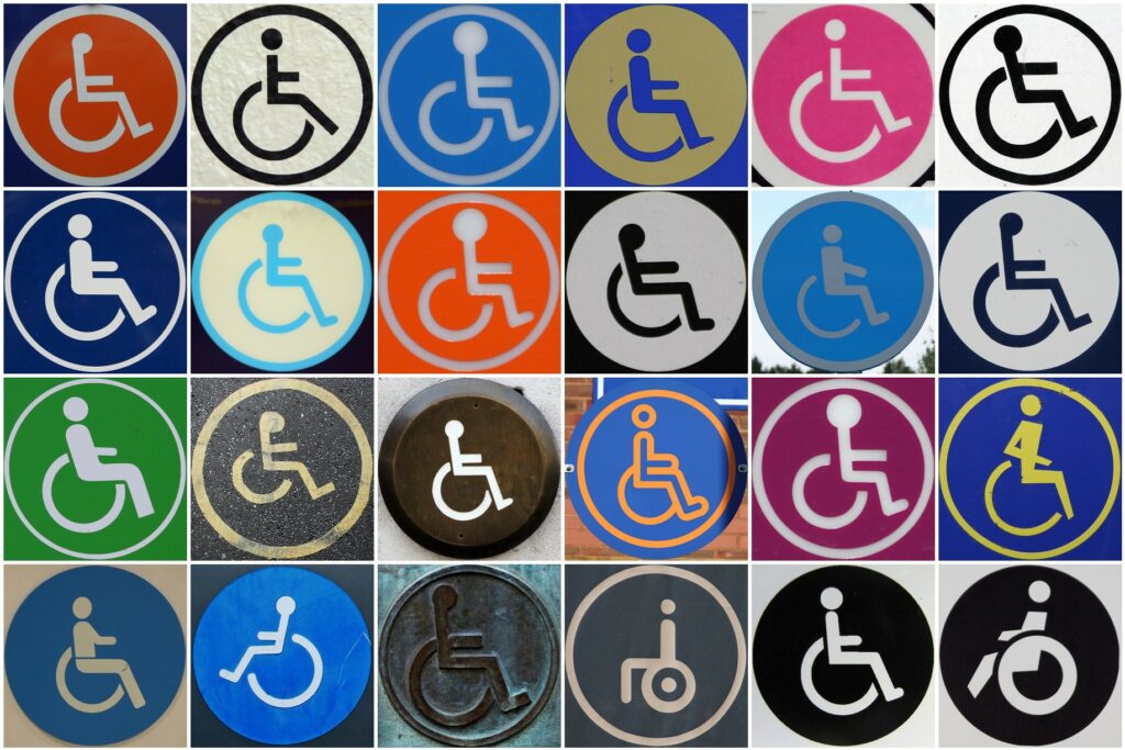 The image is a collage featuring the wheelchair user symbol in various different colours.