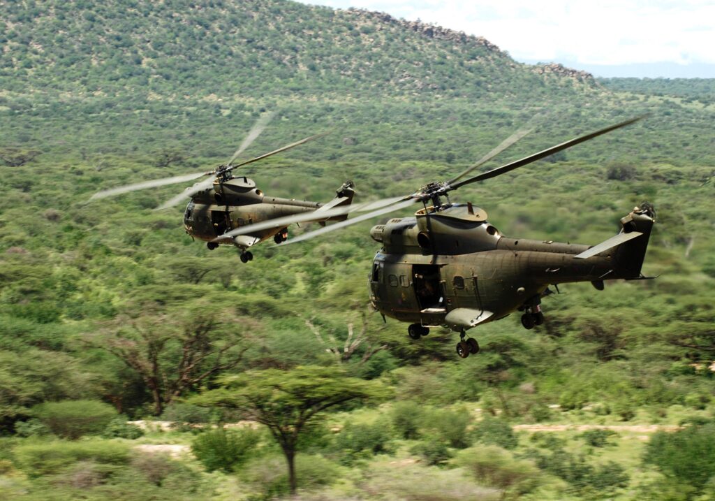 Two RAF Puma HC1 helicopters flying low and fast during Exercise Askari Thunder in Kenya.