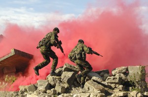 Royal Marines from 40 Commando break through a smoke cover to assault a building during FIBUA training (Fighting in a Built Up Area) at Copehill down on Salisbury Plain - by POA (Phot) Sean Clee [Crown Copyright]