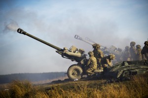 Image of The Royal Artillery firing 105mm Light Guns on exercise. (Photograph by Richard Watt; Crown Copyright)