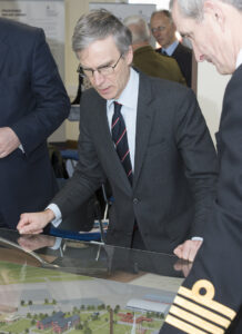 Minister for International Security Strategy, Dr Andrew Murrison MP, examines the plans for DTTC Lyneham as part of a ceremony to mark the start of construction. (Crown Copyright)