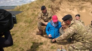 Countryfile presenters Matt Baker and Ellie Harrison getting ready to push the button to explode the ordnance on Whitsand Beach, with the Royal Navy Southern Diving Group. (Crown Copyright)