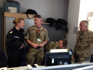 Military liaison officers Lt Col Graham Whitmore (second from left), Maj Sean Norman & Maj Duncan Mortimer discuss events with Acting Chief Constable Dee Collins, from North Yorkshire Police, at Tour de France Gold Command, Wakefield Police HQ.