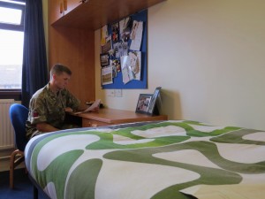 A soldier in his accommodation. (Crown Copyright)