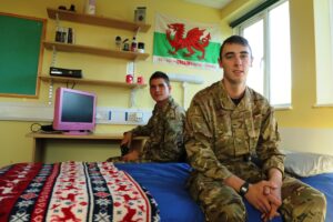 Guardsman Dale Williams (front) and Lance Corporal Nathan Williams both of 1 Welsh Guards enjoying the newly refubished living accommodation. [Crown Copyright]