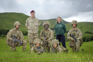 Soldiers from The Royal Highland Fusiliers 2nd Battalion of the Royal Regiment of Scotland train on land that is earmarked for a commemorative living memorial for Scotland’s First World War Heroes. They are pictured with Peter Hollins of the Ministry of Defence and Carol Evans from Woodland Trust Scotland. [Helen Pugh]