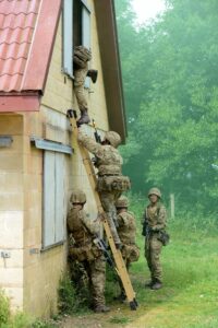 Soldiers from 1 YORKS enter a building in Copehill Down Village as part of a training exercise. [[Landmarc Support Services 2015]