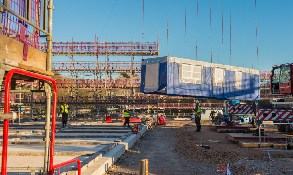 The first SLA accommodation block is lowered into position. [Crown Copyright/MOD2016]