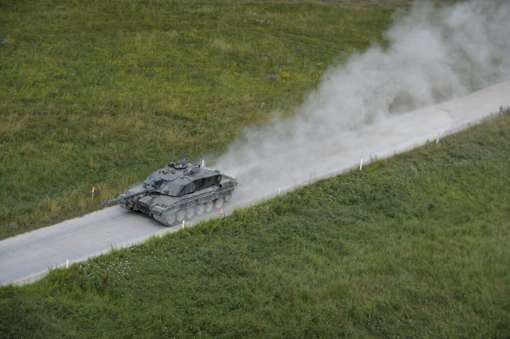 A Challenger 2 Main Battle Tank on a Salisbury Plain access road during Exercise Lion Strike. [Crown Copyright]