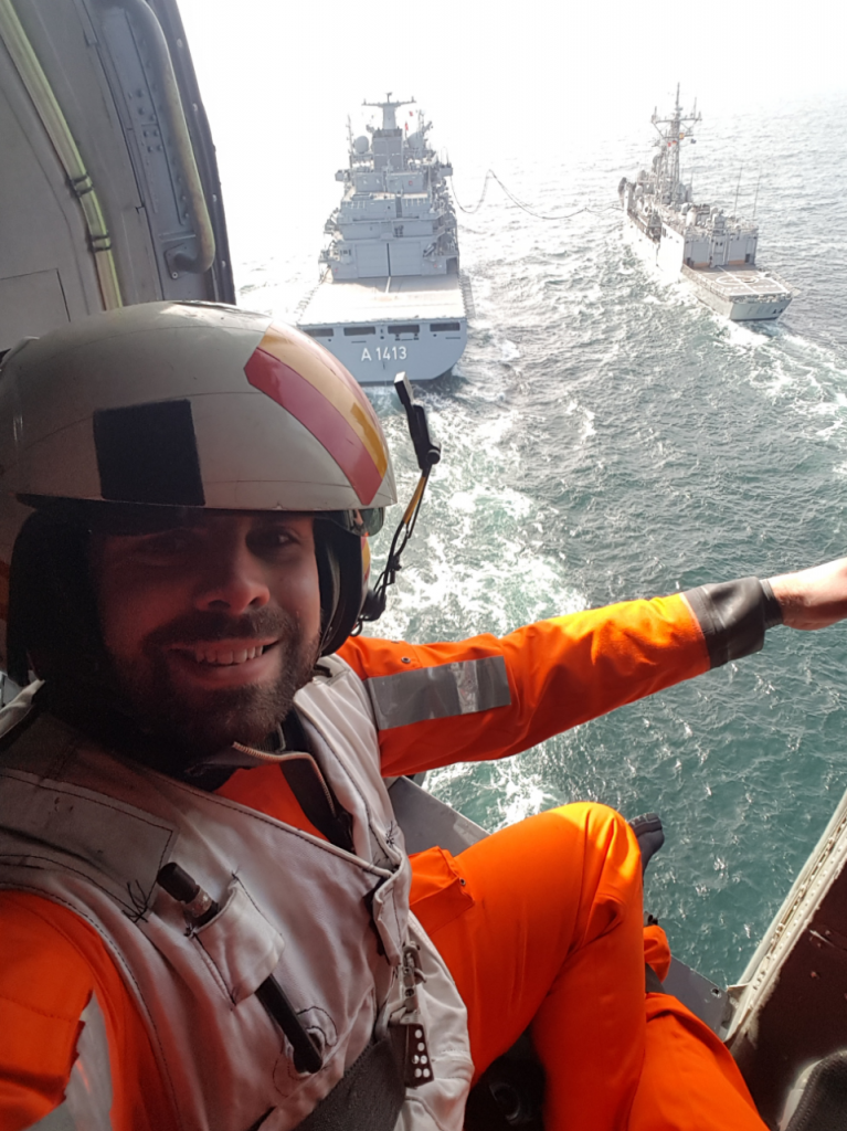 Reservist Ben Lolley in a Spanish Navy ‘SeaHawk’ helicopter flying over two ships being replenished at sea. [Crown Copyright, MOD 2017]