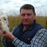 Jonathan Pepper with an owl. [All rights reserved]