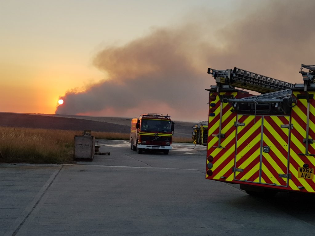 Firefighters from Dorset & Wiltshire Fire and Rescue Service monitoring the fire on Salisbury Plain Training Area. [Photograph courtesy of Dorset & Wiltshire Fire and Rescue Service]