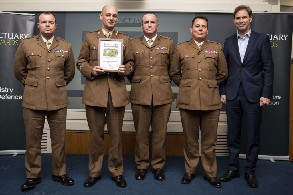 Soldiers from the Albermarle Barracks War on Waste team pose with their award and Minister of Defence Personnel and Veterans, Tobias Ellwood MP