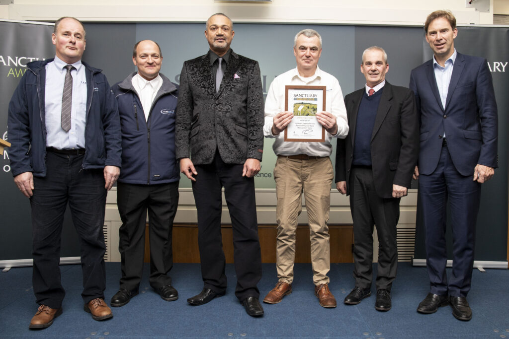 Representatives of Landmarc's Sustainability and Waste Management Team pose with their award and Minister of Defence Personnel and Veterans, Tobias Ellwood MP.