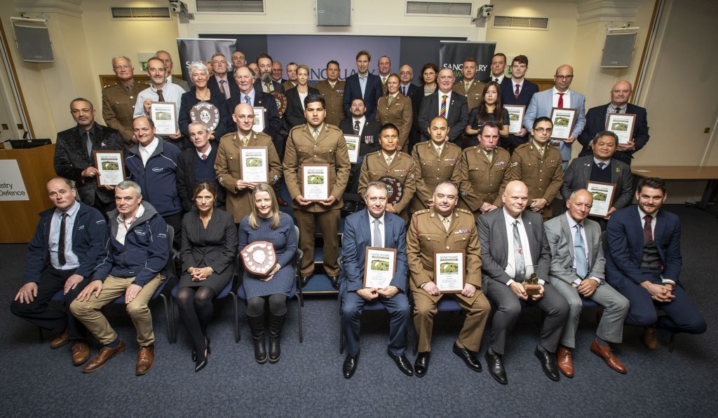 The winners and runners up pose in a group photo with their awards, certificates and Minister for Defence Personnel and Veterans, Tobias Ellwood MP.