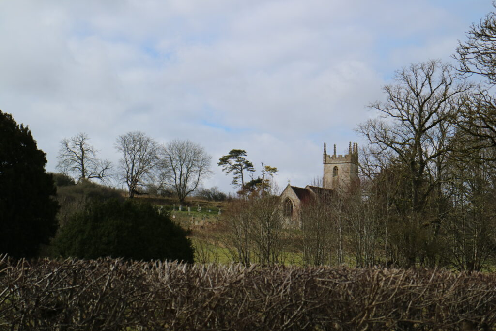 Landscape of the St Giles' Church in Imber in Salisbury Plain. The church is a scheduled monument that DIO manages and protects.