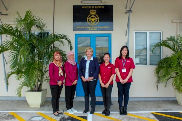 Lucy Bogue standing with four female staff members in front of a building.