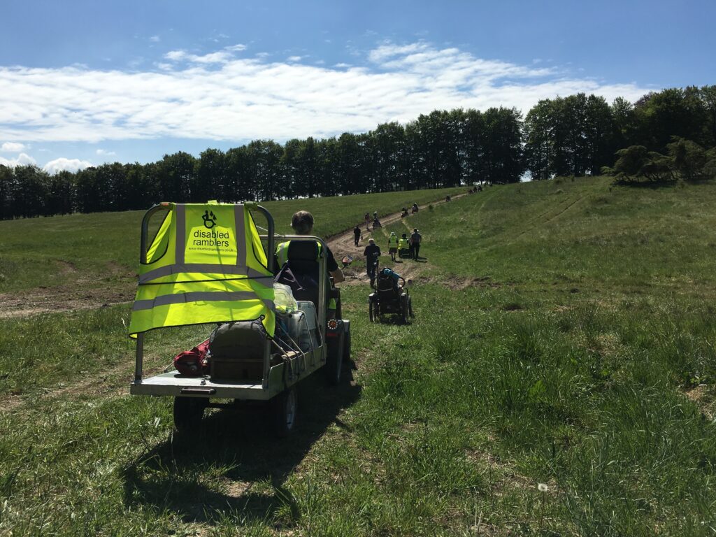 The Disabled Ramblers are heading down a path surrounded by grass and trees on the Salisbury Plain Training Area 