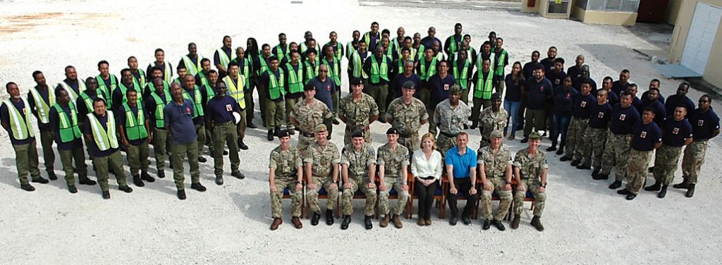 A posed image of Kate Harrison together with the military and civilian staff of BATSUB, including Locally Employed Civilians. 