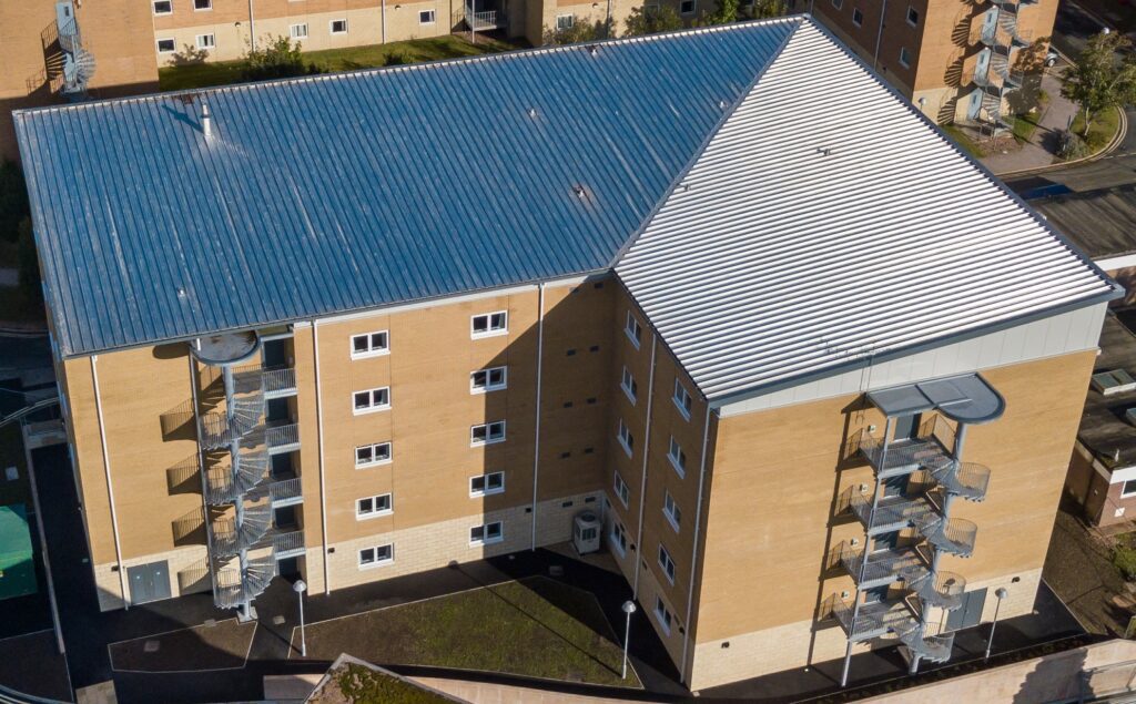 An aerial view of a large multi-storey brick building. 