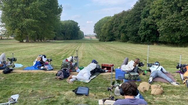 The shooting range in use by a group of people.